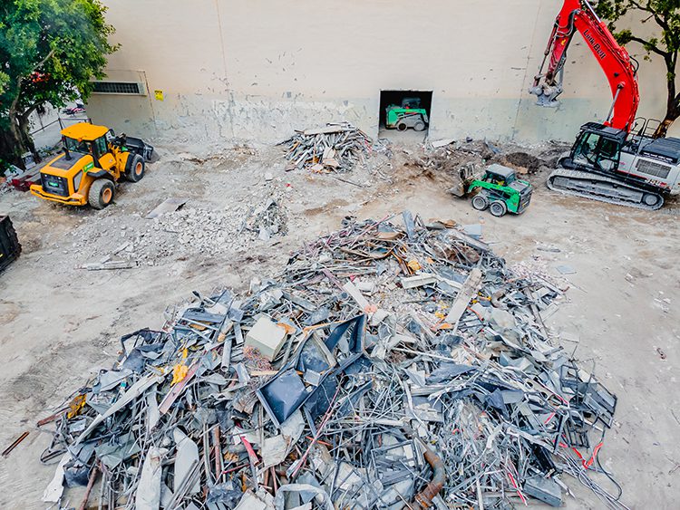 Sort demolition materials at Miami demolition project