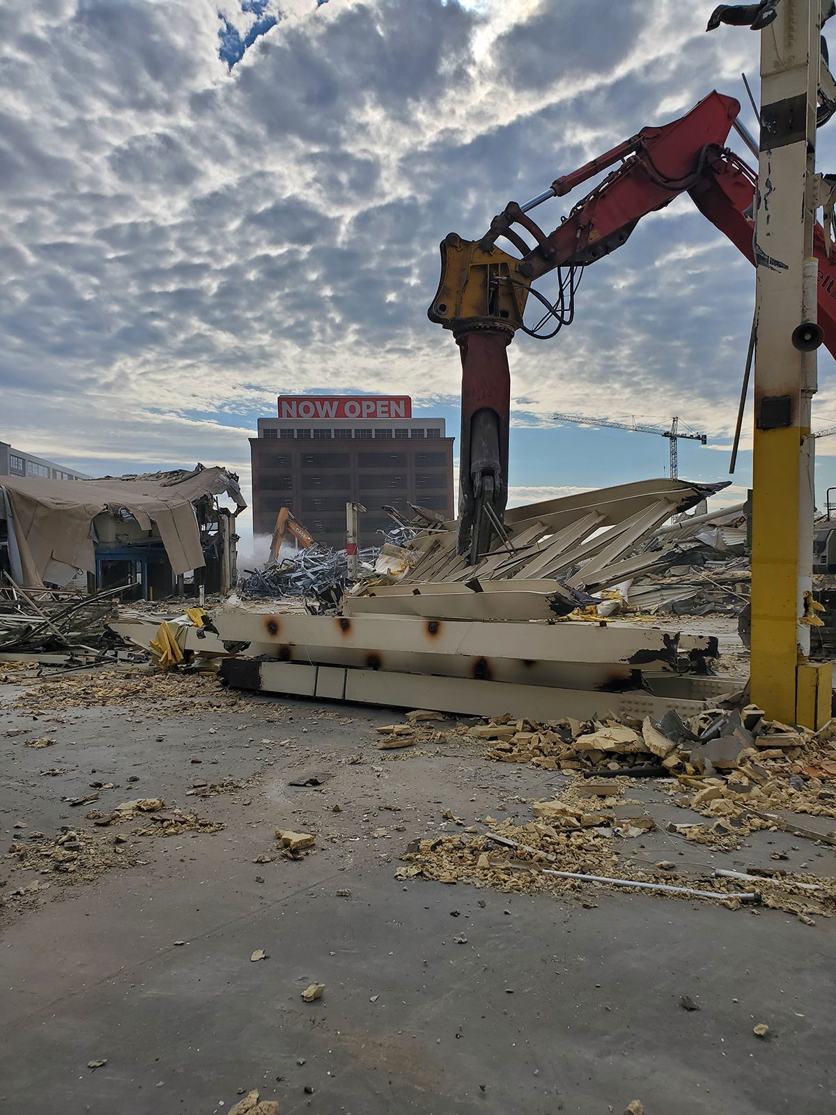 Demolition in progress with heavy equipment