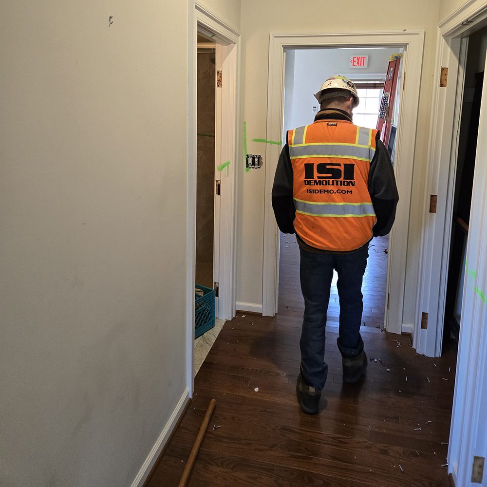 Team member walking through Interior demolition at Hole in the Wall Mid Atlantic expansion